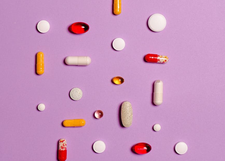 medication pills isolated on purple background