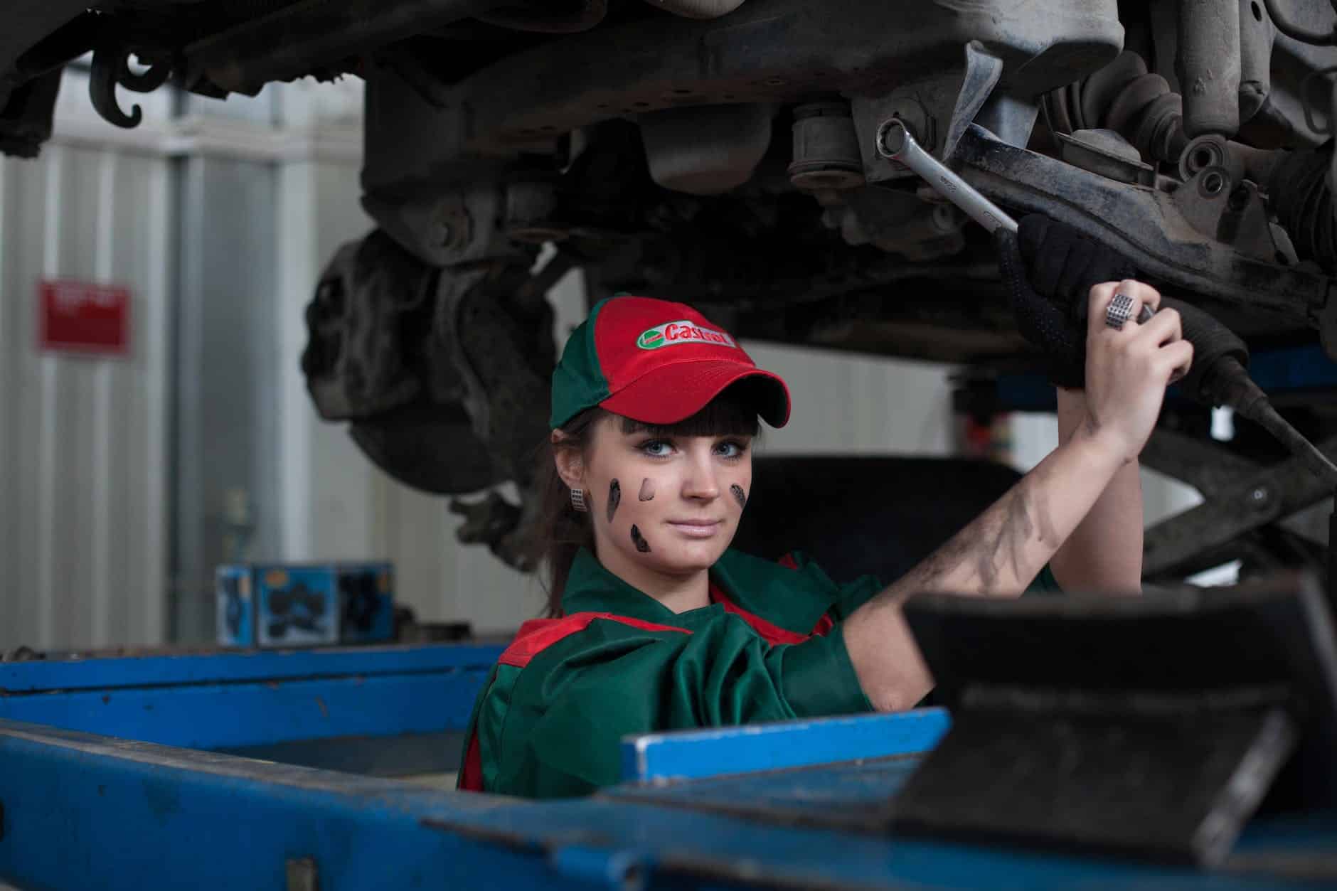 woman holding gray steel wrench