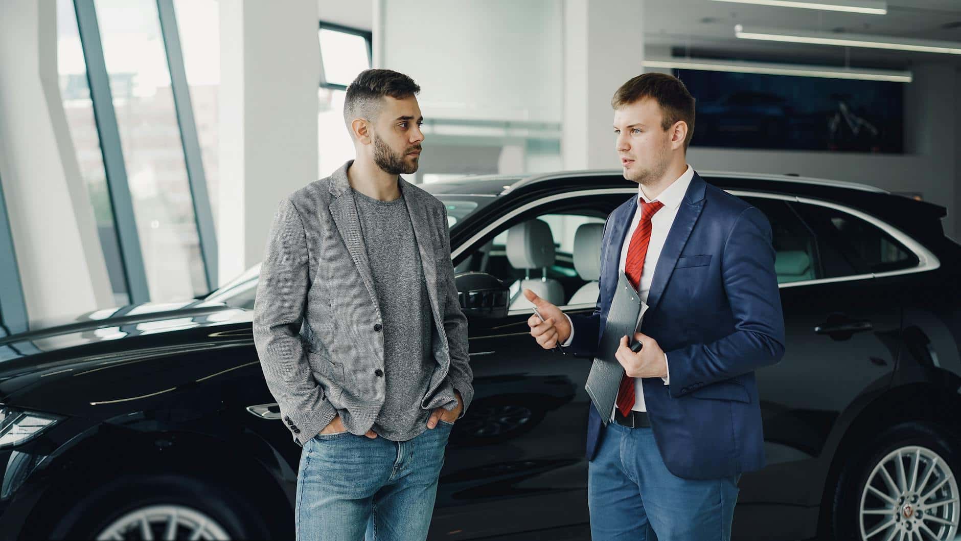 car dealership business discussion indoors