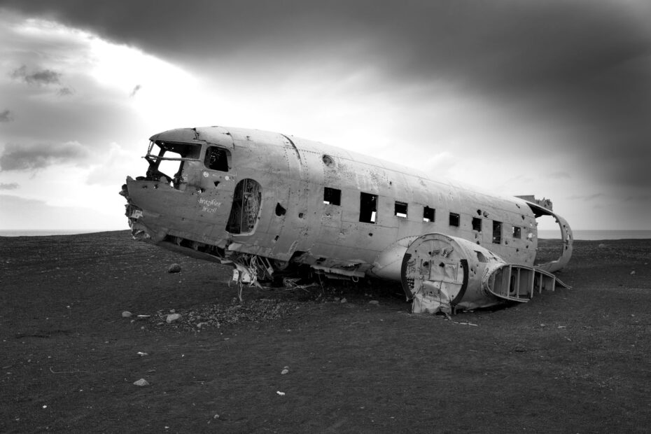 grayscale photo of a plane wreck