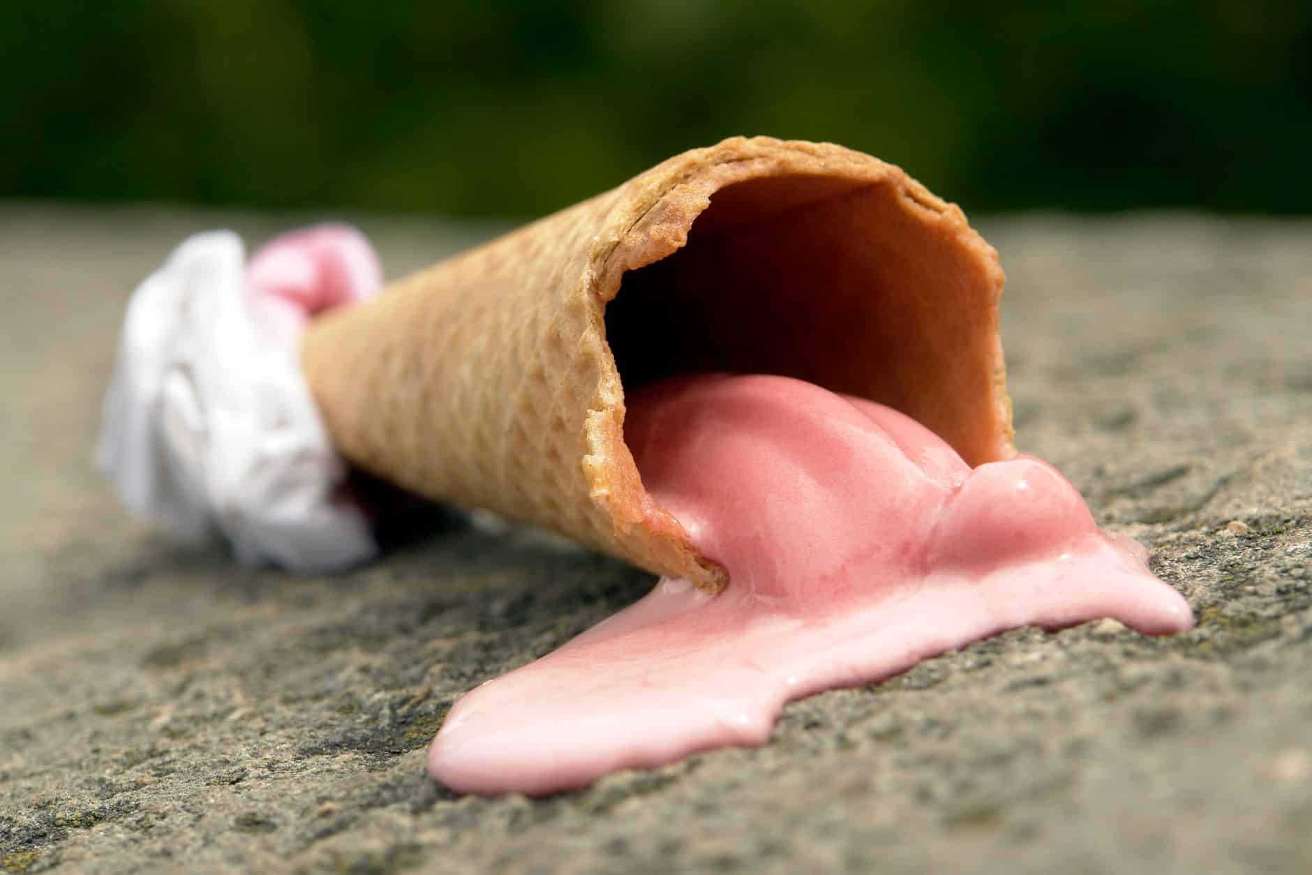 close up shot of melted ice cream on cone